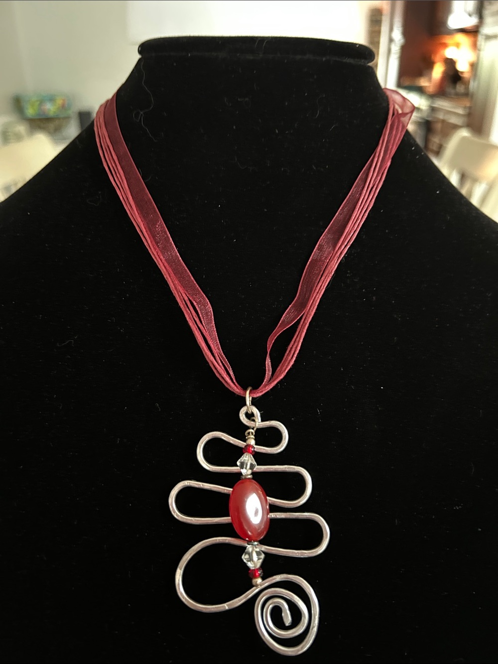 Red Ribbon Pendant Necklace with Silver-Tone Abstract Scroll and Beads